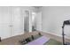 Exercise room featuring a treadmill, yoga mat, and weight-lifting equipment at 3380 Labrouste Cv, Duluth, GA 30097