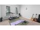 Exercise room featuring a treadmill, free weights, and musical instruments at 3380 Labrouste Cv, Duluth, GA 30097