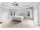 Bright, spacious bedroom with carpet and three large windows at 3380 Labrouste Cv, Duluth, GA 30097