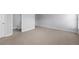 Carpeted bedroom with view into bathroom at 3380 Labrouste Cv, Duluth, GA 30097