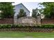 A stone 'Bellmoore Park' community sign, framed by manicured landscaping and lush green lawn at 3380 Labrouste Cv, Duluth, GA 30097