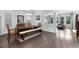 Open-concept dining room with dark hardwood floors, traditional furnishings, and ample natural light at 3380 Labrouste Cv, Duluth, GA 30097