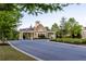 Elegant stone and pillar entrance welcomes residents and guests to a beautifully maintained community at 3380 Labrouste Cv, Duluth, GA 30097