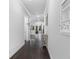 Spacious hallway featuring dark hardwood floors and neutral paint at 3380 Labrouste Cv, Duluth, GA 30097