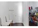 Hallway with coat rack and bench next to pantry with door at 3380 Labrouste Cv, Duluth, GA 30097