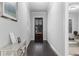 Bright entry hallway with hardwood floors, leading to multiple rooms at 3380 Labrouste Cv, Duluth, GA 30097