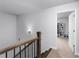 Second floor hall with wood railing, and access to the rooms at 3380 Labrouste Cv, Duluth, GA 30097