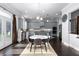 Eat-in kitchen with grey cabinetry, black countertops, stainless appliances, and access to backyard at 3380 Labrouste Cv, Duluth, GA 30097