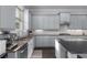 Kitchen with stainless steel appliances, granite counters, and custom cabinetry at 3380 Labrouste Cv, Duluth, GA 30097
