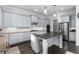 Spacious kitchen with island, stainless steel appliances, and ample countertop space at 3380 Labrouste Cv, Duluth, GA 30097