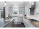 Modern kitchen featuring stainless steel appliances and access to the backyard at 3380 Labrouste Cv, Duluth, GA 30097