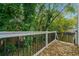 Deck with painted railings and greenery provide an ideal backyard setting at 962 Welch Sw St, Atlanta, GA 30310