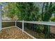 Deck with painted black wrought iron railings and greenery provide an ideal backyard setting at 962 Welch Sw St, Atlanta, GA 30310