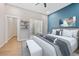 Comfortable bedroom with large bed, ensuite bathroom, and closet space with shelves, and plenty of natural light at 962 Welch Sw St, Atlanta, GA 30310
