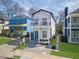 Charming two-story home features a balcony, blue door, and inviting front porch at 962 Welch Sw St, Atlanta, GA 30310