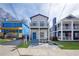 Charming two-story home featuring dual balconies and a vibrant turquoise-colored front door at 962 Welch Sw St, Atlanta, GA 30310