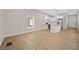 Spacious living room featuring a kitchen, light wood floors, and natural light at 962 Welch Sw St, Atlanta, GA 30310