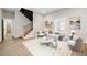 Bright living room with staircase, modern furniture, and large windows allowing for lots of natural light at 962 Welch Sw St, Atlanta, GA 30310