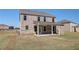 Brick home backyard featuring a covered patio at 228 Chiswick Loop, Stockbridge, GA 30281