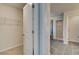 Walk-in closet featuring wire shelving, carpet and a separate door to the bathroom at 228 Chiswick Loop, Stockbridge, GA 30281