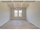 Cozy dining room featuring modern chandelier and large window that provides natural light at 228 Chiswick Loop, Stockbridge, GA 30281