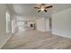 Spacious living room connected to the kitchen area with modern flooring and recessed lighting at 228 Chiswick Loop, Stockbridge, GA 30281