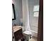 Cozy bathroom featuring white tiled walls, dark vanity and checkerboard flooring at 286 Booker Sw St, Atlanta, GA 30315