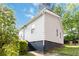 Charming ranch-style home with fresh white siding is surrounded by mature landscaping and green lawns at 286 Booker Sw St, Atlanta, GA 30315