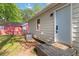 An exterior side-view of the home featuring steps to the door with a small 'hello' mat at 286 Booker Sw St, Atlanta, GA 30315