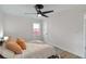 Relaxing bedroom with natural light, a ceiling fan, and cozy bedding at 286 Booker Sw St, Atlanta, GA 30315