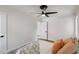 Bright bedroom with a ceiling fan, a cozy bed, and natural light at 286 Booker Sw St, Atlanta, GA 30315