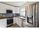 Modern kitchen featuring butcher block countertops, stainless steel appliances, and ample cabinet space at 286 Booker Sw St, Atlanta, GA 30315