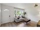 Inviting living room featuring hardwood floors and a comfortable couch with natural light at 286 Booker Sw St, Atlanta, GA 30315