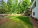 Expansive backyard featuring a large lawn and a two-level deck perfect for outdoor entertaining at 4910 Conover Dr, Atlanta, GA 30338