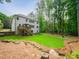 Large backyard with a two-level deck, fire pit, and tranquil stream for ultimate outdoor enjoyment at 4910 Conover Dr, Atlanta, GA 30338
