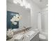 Modern bathroom with a granite vanity, subway tile shower, and sleek fixtures at 4910 Conover Dr, Atlanta, GA 30338