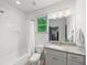 Bright bathroom with a shower-tub combo, white subway tile, and a granite vanity at 4910 Conover Dr, Atlanta, GA 30338