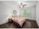 Cozy bedroom with hardwood floors, a ceiling fan, and a bright sunny window at 4910 Conover Dr, Atlanta, GA 30338