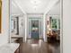 Elegant Foyer with dark wood floors, white trim, and a view to the exterior at 4910 Conover Dr, Atlanta, GA 30338