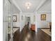 View of elegant hallway with wood floors, neutral walls and sophisticated trim at 4910 Conover Dr, Atlanta, GA 30338