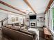 Spacious living room with a fireplace, hardwood floors, and a comfortable leather sofa at 4910 Conover Dr, Atlanta, GA 30338