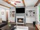 Living room featuring a fireplace, built-in shelving, and decorative accents at 4910 Conover Dr, Atlanta, GA 30338