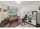 This office has dark wood floors, white walls, and bright natural light at 4910 Conover Dr, Atlanta, GA 30338