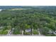 An aerial view of a home on a 1.08 acre lot surrounded by mature trees at 6104 Floyd St, Covington, GA 30014