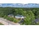 An aerial view of the property, showing the surrounding lush green landscape and neighborhood at 6104 Floyd St, Covington, GA 30014