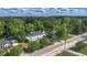 Aerial view showing a large house with lush greenery, neighborhood streets and abundant foliage at 6104 Floyd St, Covington, GA 30014