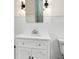 Classic bathroom with pedestal sink and tiled walls, featuring a clean and timeless aesthetic at 6104 Floyd St, Covington, GA 30014