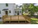 New wooden deck with stairs and railing provides a beautiful outdoor living space at 6104 Floyd St, Covington, GA 30014