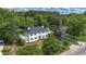 Expansive aerial view of a gracious two-story residence, showcasing its generous lawn and convenient proximity to neighborhood at 6104 Floyd St, Covington, GA 30014