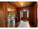 Welcoming foyer with hardwood floors, complemented by an elegant rug and direct access to a bright and airy living space at 6104 Floyd St, Covington, GA 30014